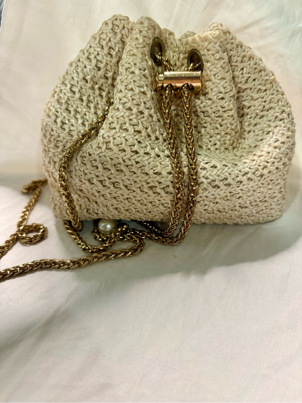 Woven Drawstring Shoulder Bag in Cream with Gold Chain